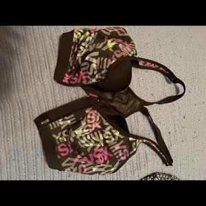 VSX Victoria Secret sports bra, 36c. Front closure with zip over. Racer back.